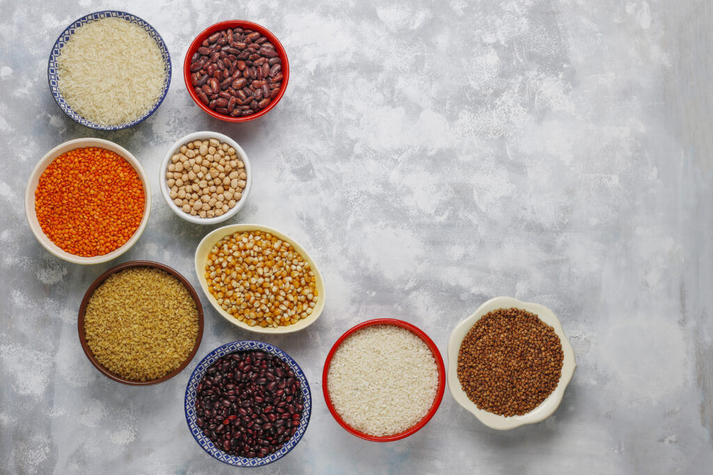 A whole range of assorted pulses can be seen here in small containers
